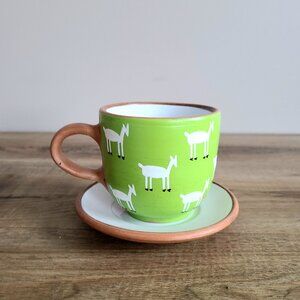 Peru red clay handmade hand painted cup and saucer with goat design.